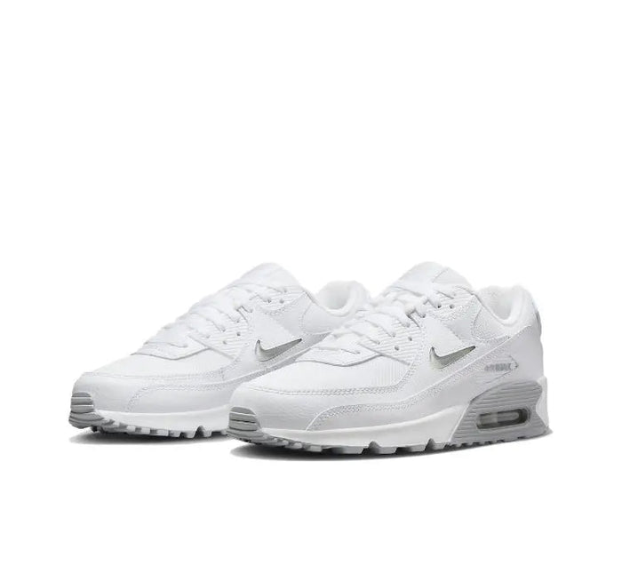 Nike Air Max 90 sneaker in white/grey, angled front view with swoosh