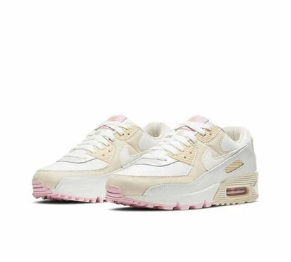 Nike Air Max 90 low-top sneakers, side view, white with beige overlays and pink sole