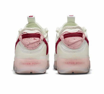 Nike Air Max 90 sneakers, heel view with burgundy trim and pink-tinted sole
