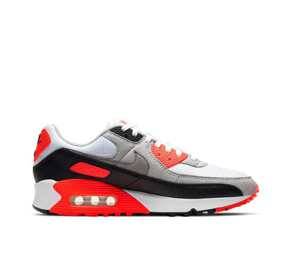 Air Max 90 running sneakers in white, gray, black, and red with visible Air window