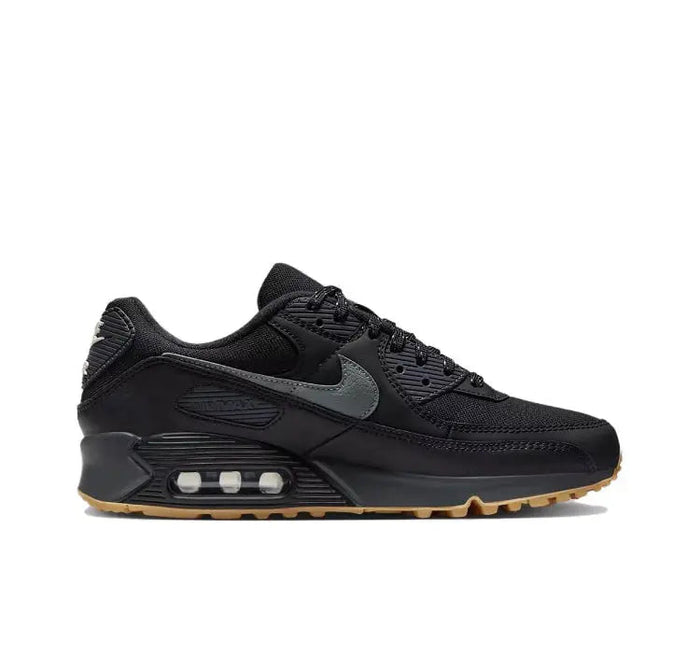 Nike Air Max 90 sneakers with gray side panel, black upper, and air window