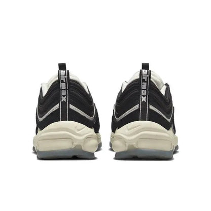 Nike sneaker pair, rear view with black heel and white sole, lace-up