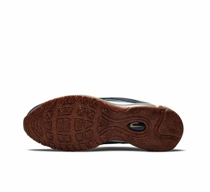 Dark brown shoe outsole with oval traction cutout and light midsole edge