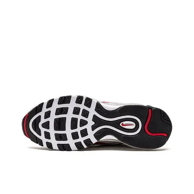Black and silver outsole of a running sneaker with red swoosh detail