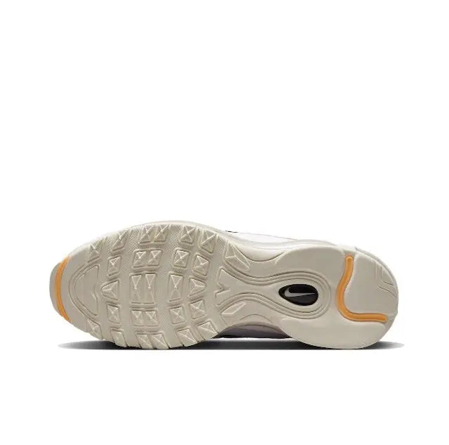 Running sneaker outsole, light tan with black swoosh mark and amber side detail