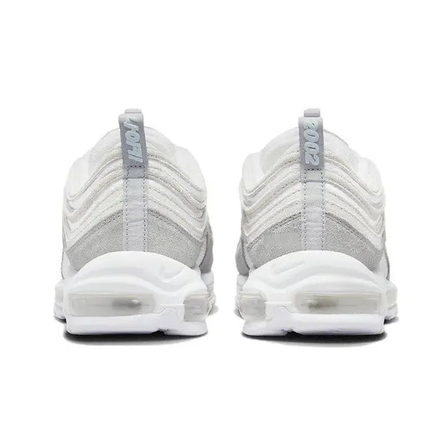 White lace-up sneaker heels with cushioned sole and padded heel tab