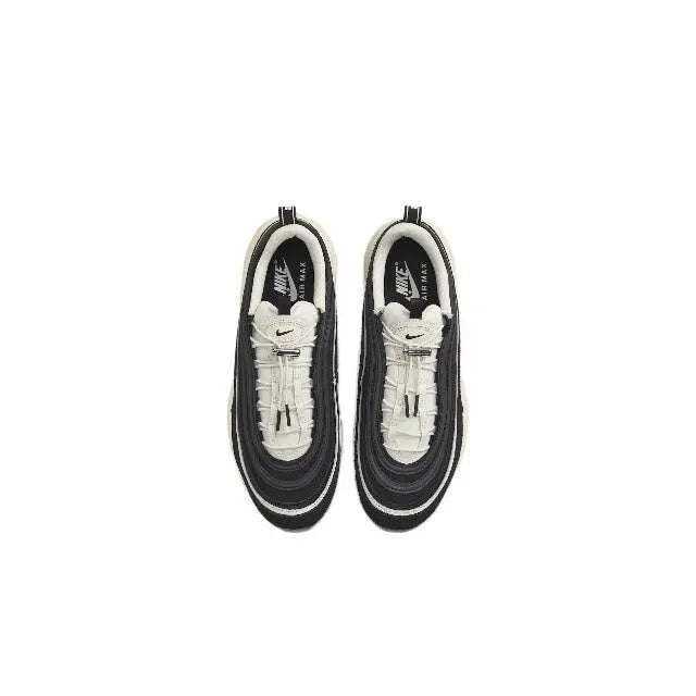 Nike sneaker pair, black and white interior with laces and Swoosh on tongue