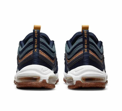 Pair of navy running shoes with white midsole, brown speckled outsole, tan lace tabs