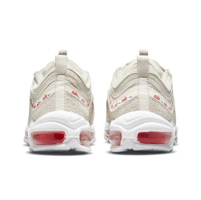 Cream heel view of lace-up running sneaker with red Air window details