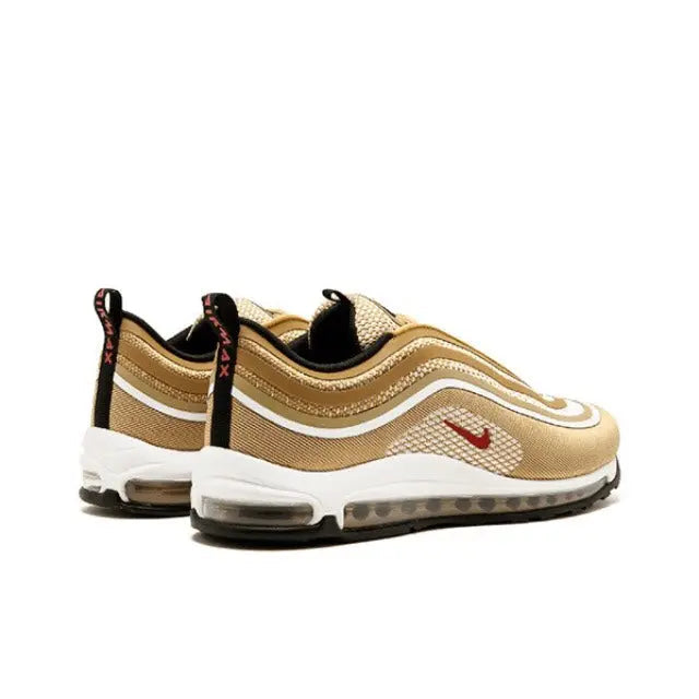 Nike Air Max 97 shoe in tan and cream with red swoosh, black heel pull tab
