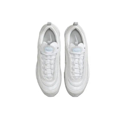 Pair of white low-top sneakers with lace-up uppers and padded collars