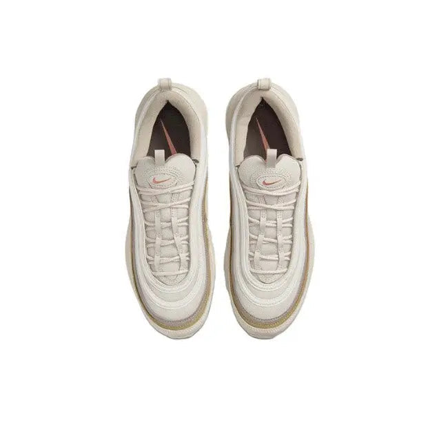 Nike Air Max 97 top view in cream, lace-up upper and cushioned interior