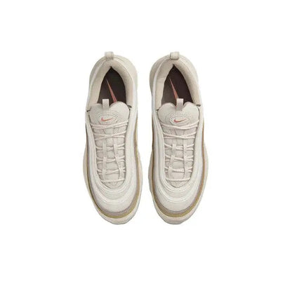 Nike Air Max 97 top view in cream, lace-up upper and cushioned interior