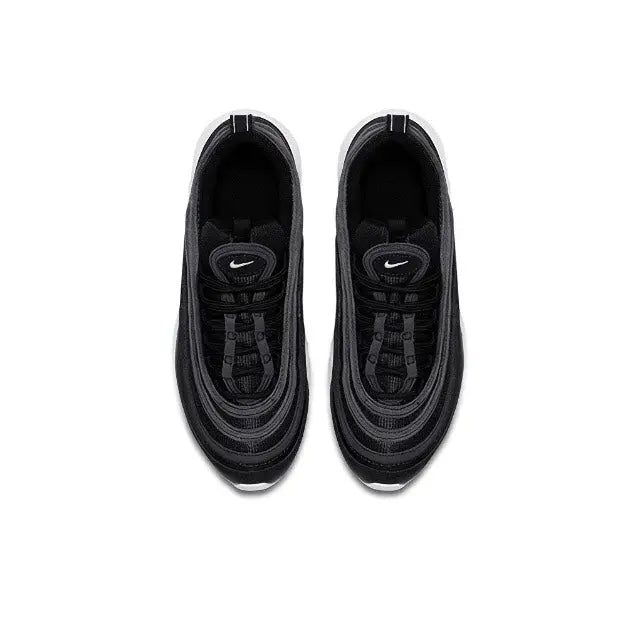 Black low-top sneaker top view with lace-up closure and dark interior lining