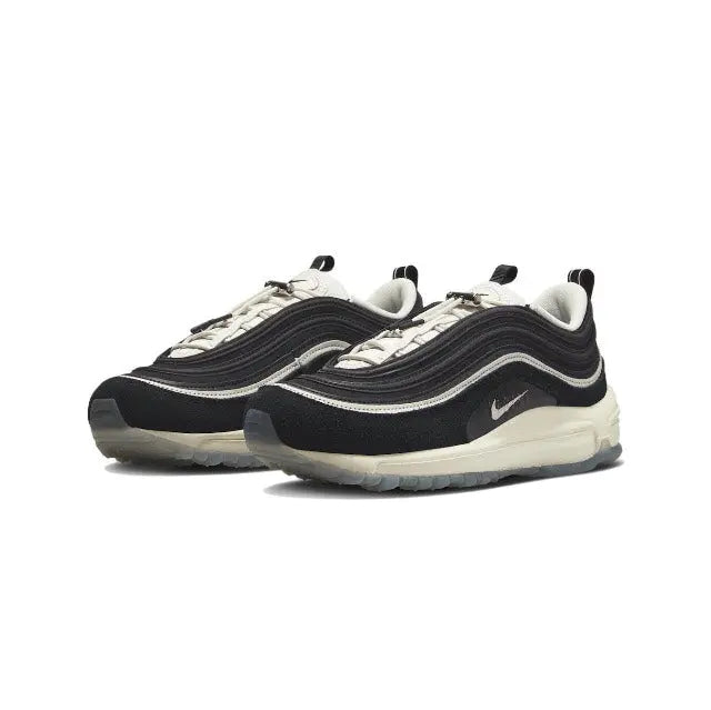Nike sneaker, black upper with light overlays, white laces, and cushioned midsole
