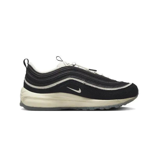 Nike sneaker, side profile in black with white midsole and Swoosh logo