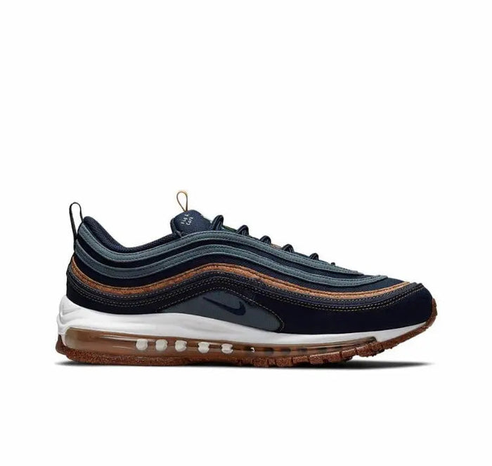 Side view running shoe in dark navy with white midsole, brown outsole, tan lace pull