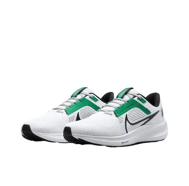 Front side view of white running shoes with green strap and black swoosh