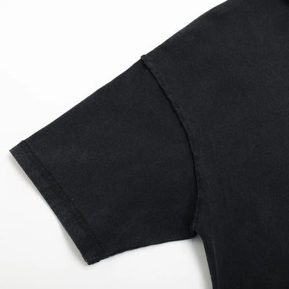 Black T-shirt sleeve hem close-up with stitched cuff