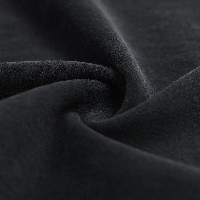 Black T-shirt fabric close-up with soft knit texture