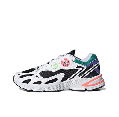 Adidas Astir sneakers in white with black cutouts and neon green heel