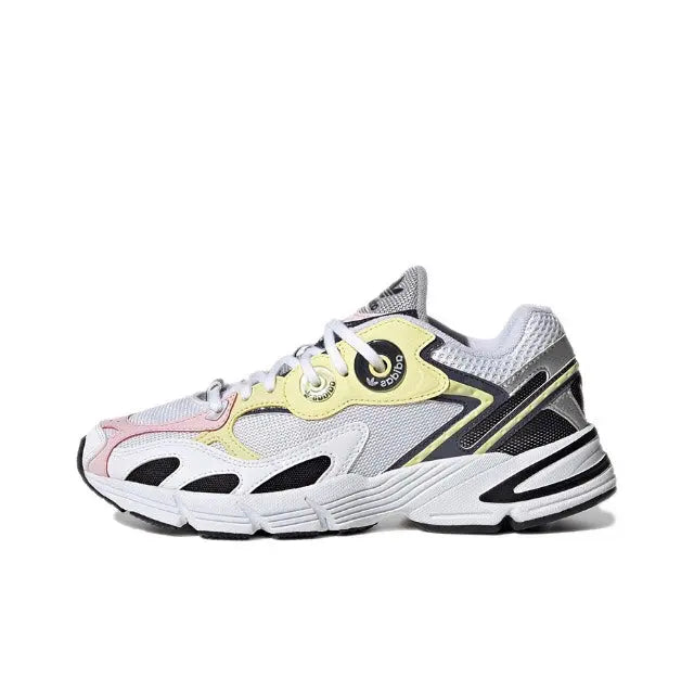Adidas Astir sneaker, white mesh with black and yellow trim, lace-up.