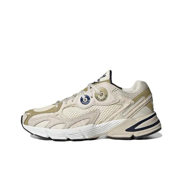 Adidas Astir lace-up sneaker in cream with gold and navy accents, chunky rubber sole
