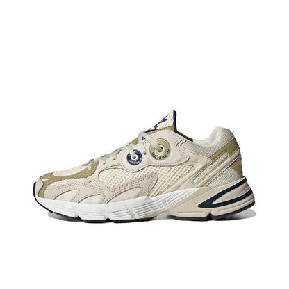Adidas Astir lace-up sneaker in cream with gold and navy accents, chunky rubber sole