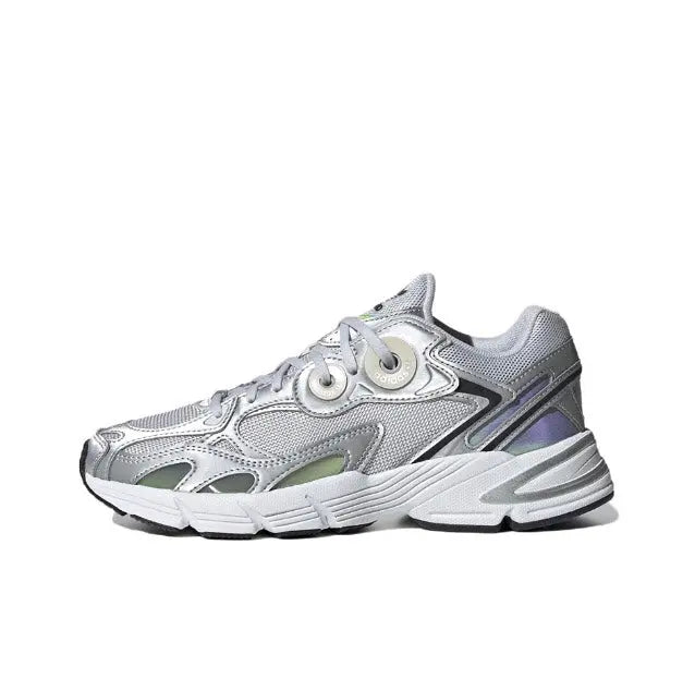 Low-top silver athletic sneaker with black accents, lace-up front, padded collar.