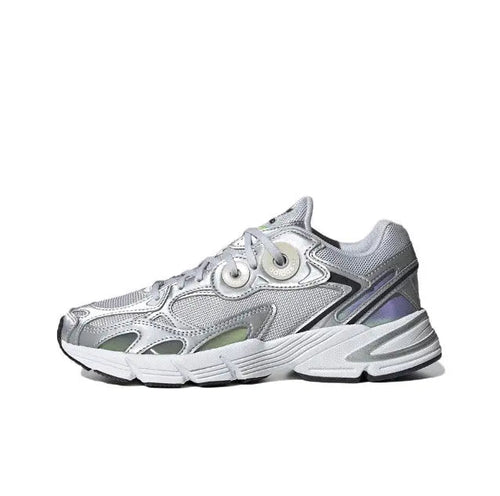 Low-top silver athletic sneaker with black accents, lace-up front, padded collar.