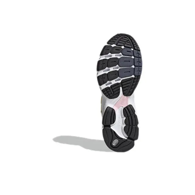 Adidas Astir sneaker outsole, white rubber tread with black traction pattern.
