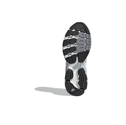 Adidas Astir sneaker outsole with black tread and gray midsole