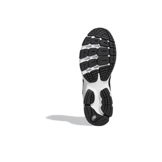 Shoe outsole view with black-and-white tread pattern and raised traction pods