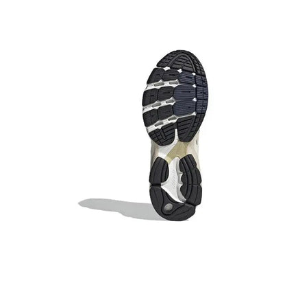 Shoe outsole for cream and gold lace-up sneaker, black tread pattern and white midsole