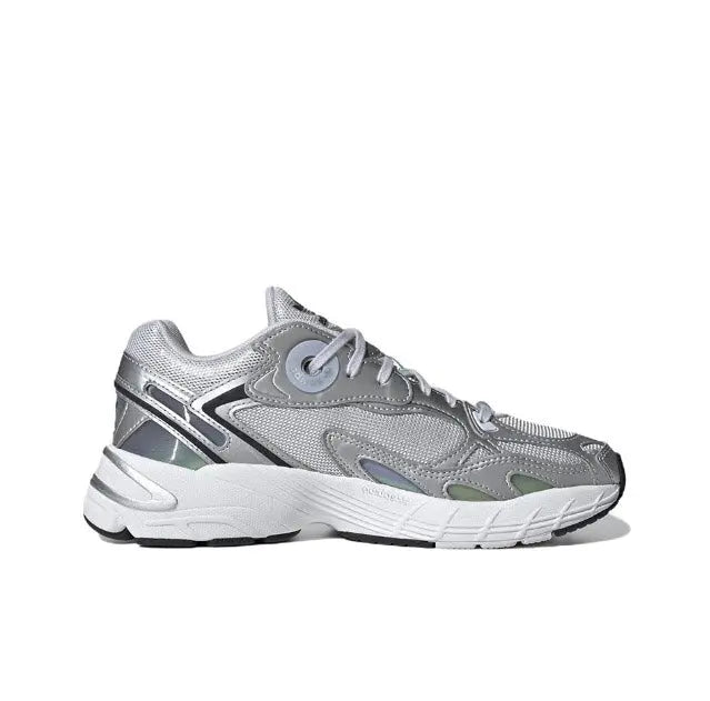 Low-top silver athletic sneaker, diagonal side stripe, lace-up with white midsole.