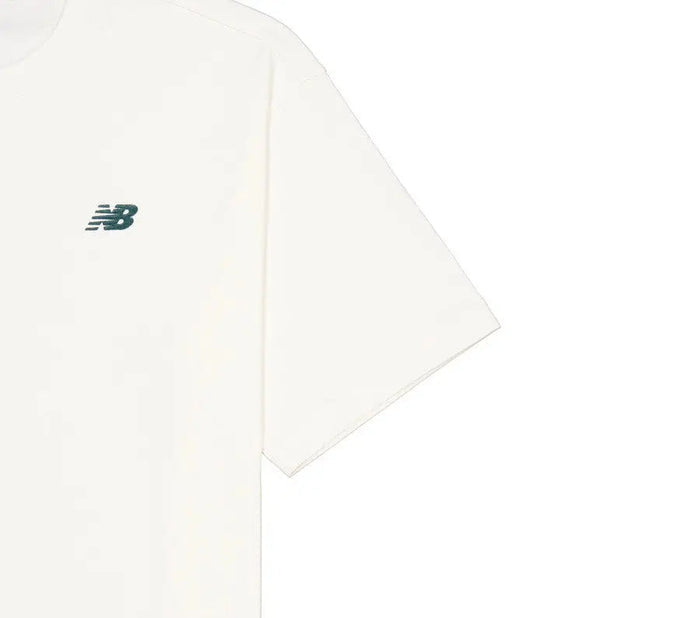 White crewneck T-shirt close-up of side seam and small New Balance logo
