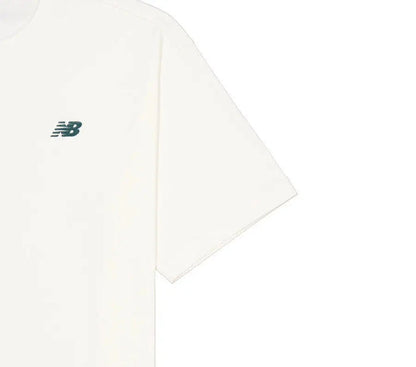 White crewneck T-shirt close-up of side seam and small New Balance logo