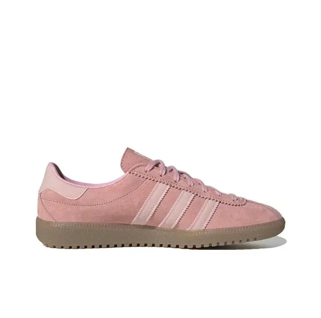 Pink low-top sneakers, lace-up front and three-stripe side detail, gum sole
