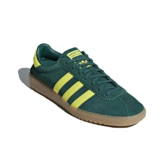 Low-top sneakers, dark green upper with yellow stripes and gum outsole