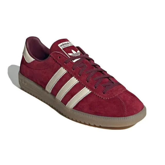 Adidas Bermuda sneaker, maroon upper with white triple stripes and lace-up front.