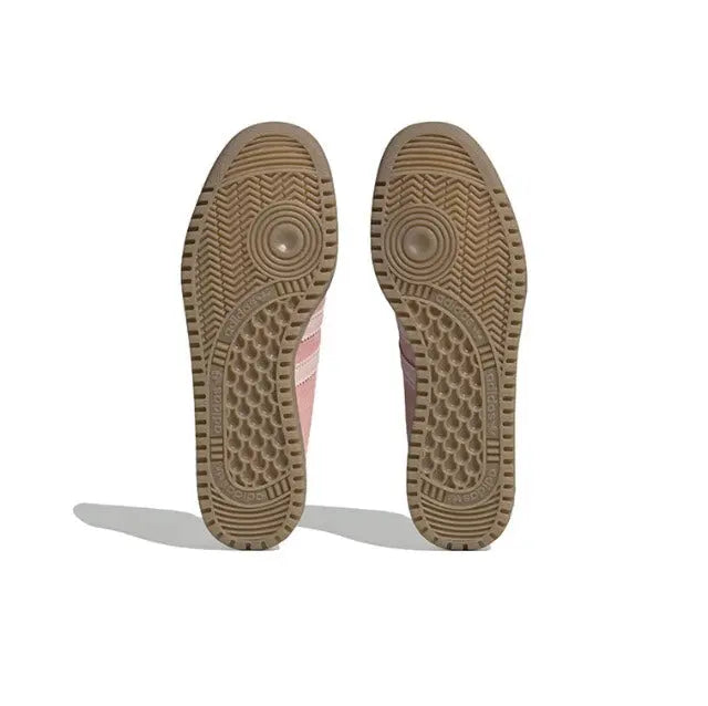 Gum rubber outsole with patterned traction tread and circular heel markings