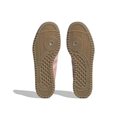 Gum rubber outsole with patterned traction tread and circular heel markings