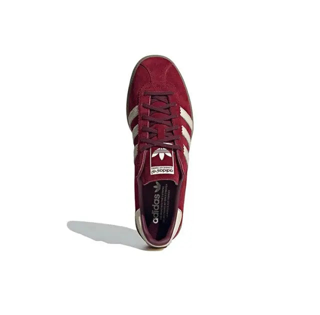 Adidas Bermuda sneaker heel view, maroon leather with lace-up and white trim stripes.