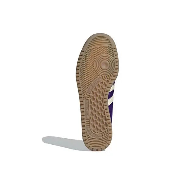 Adidas Bermuda sneaker outsole with textured tan tread and white stripe detail
