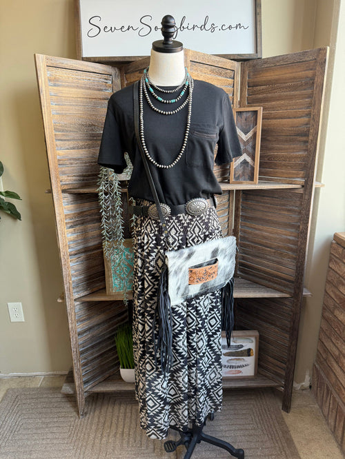 Black-and-white aztec maxi skirt on mannequin, full length tiered hem