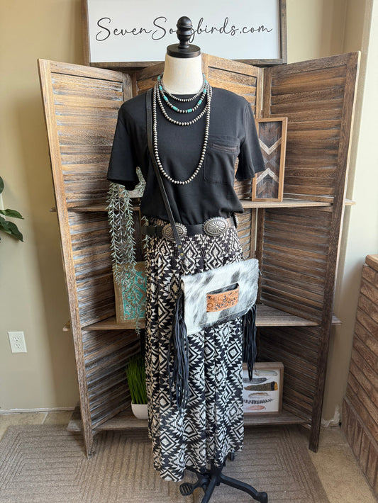 Black-and-white aztec maxi skirt on mannequin, full length tiered hem