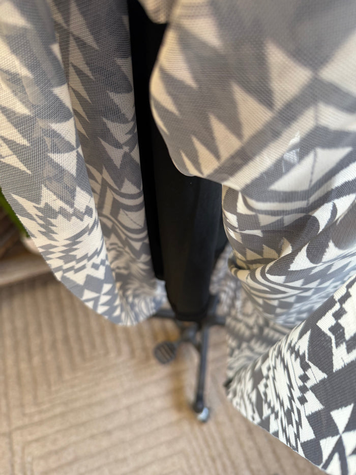 Black-and-white aztec patterned skirt with elastic waistband, side view