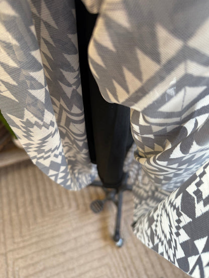 Black-and-white aztec patterned skirt with elastic waistband, side view