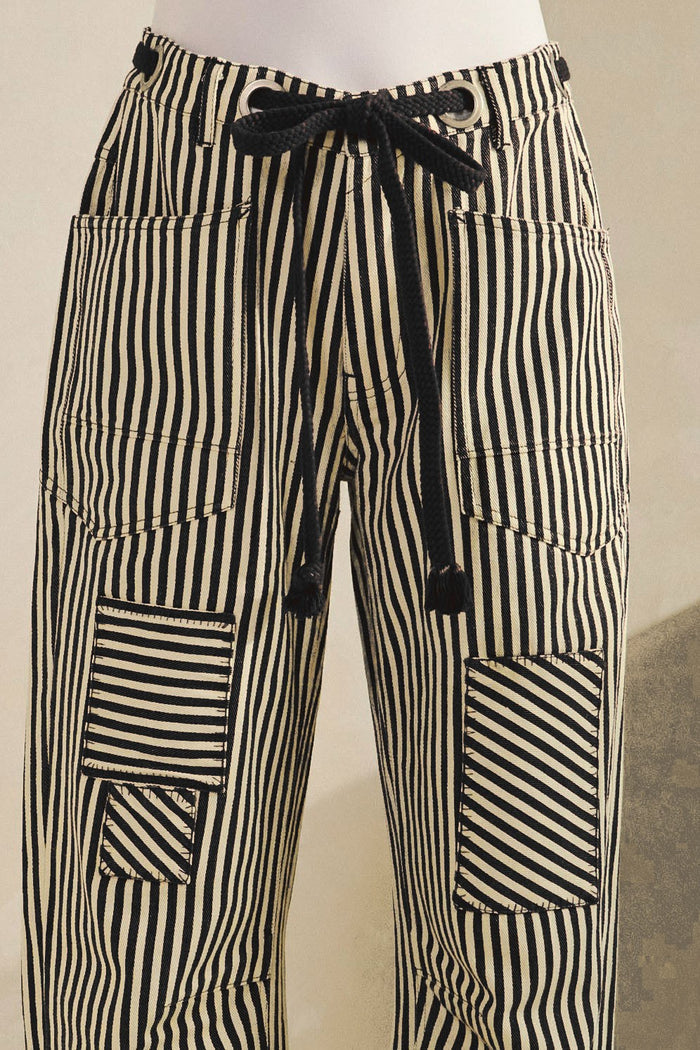 Striped cotton drawstring pants with patch pockets, black and white vertical stripes