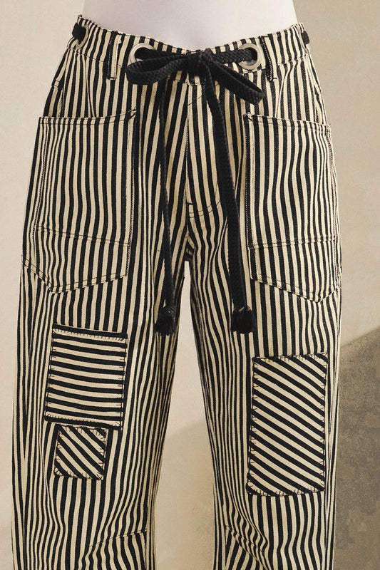Striped cotton drawstring pants with patch pockets, black and white vertical stripes